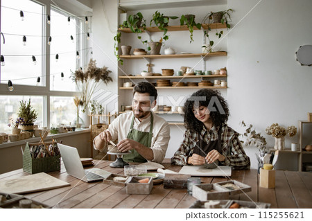 Man and woman sculpting pottery watching online video course Man and woman sculpting pottery watching online video course 115255621