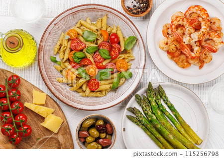 Italian pasta adorned with fresh tomatoes and aromatic basil Italian pasta adorned with fresh tomatoes and aromatic basil 115256798