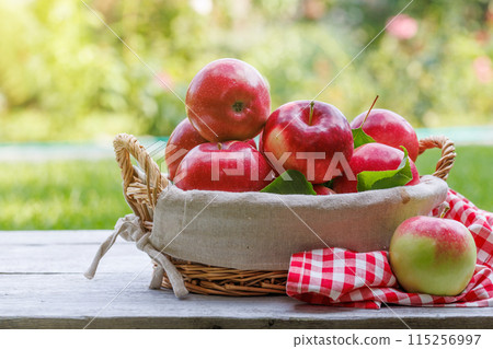 Basket with fresh red apples Basket with fresh red apples 115256997