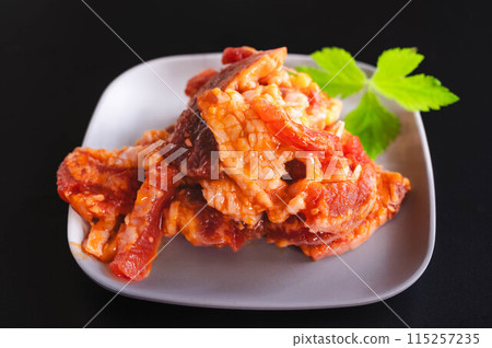 Seasoned beef belly on a plate 115257235