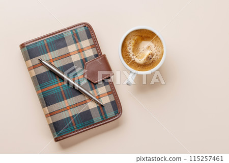 Office desk table with notepad, cup of coffee and supplies 115257461