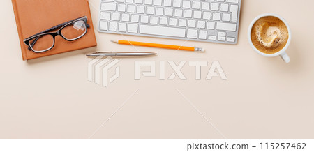Office desk table with computer, cup of coffee and supplies Office desk table with computer, cup of coffee and supplies 115257462