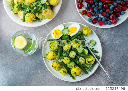 Boiled potatoes with asparagus beans and cucumbers Boiled potatoes with asparagus beans and cucumbers 115257496