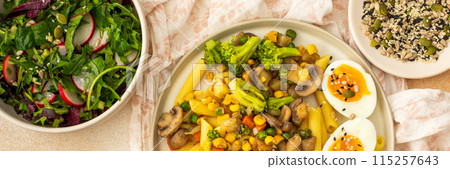 Pasta with fried mushrooms and broccoli, green peas and corn, fresh mix salad 115257643