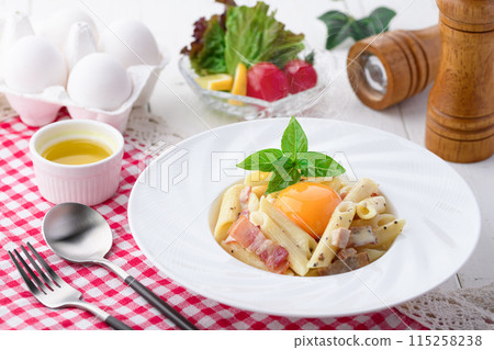 Penne Carbonara (finished with fresh cream and Parmesan) with a rich egg flavor Penne Carbonara (finished with fresh cream and Parmesan) with a rich egg flavor 115258238