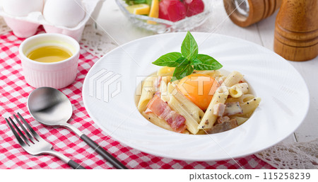 Penne Carbonara (finished with fresh cream and Parmesan) with a rich egg flavor Penne Carbonara (finished with fresh cream and Parmesan) with a rich egg flavor 115258239