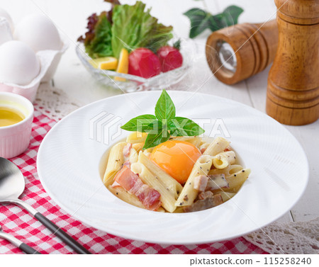 Penne Carbonara (finished with fresh cream and Parmesan) with a rich egg flavor Penne Carbonara (finished with fresh cream and Parmesan) with a rich egg flavor 115258240