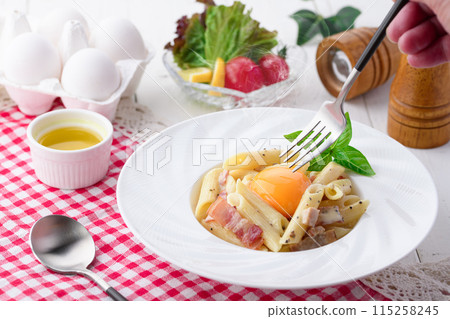 Penne Carbonara (finished with fresh cream and Parmesan) with a rich egg flavor 115258245