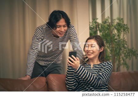 Men and women using smartphones 115258477