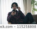 A man talking on a smartphone 115258808