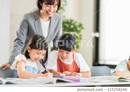 Elementary school students studying at cram school. Elementary school students studying at cram school. 115259248