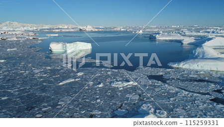 Frozen polar arctic winter landscape aerial view. Antarctica melting blue water iceberg. Antarctic ocean environment. Arctic Ice. Antarctica travel exploration. Ecology, climate change global warming 115259331