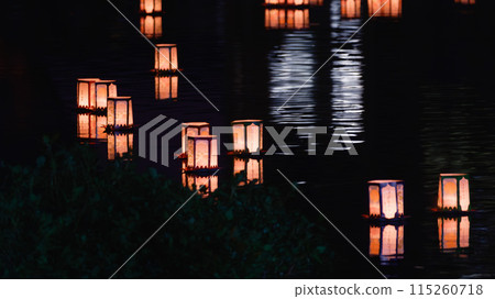 The light of a lantern floating in the quiet night The light of a lantern floating in the quiet night 115260718