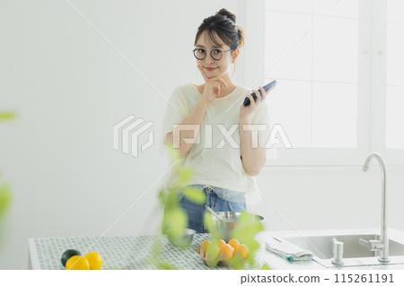 Woman in the kitchen 115261191