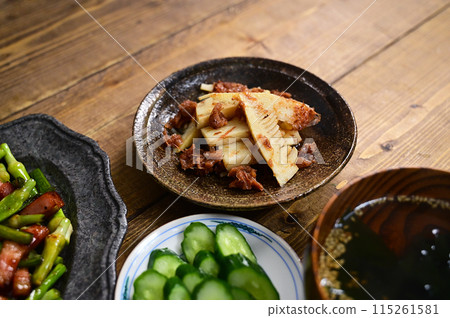 Soup and two side dishes: Bamboo shoots dressed in bonito flakes and pickled plum, fried garlic sprouts and bacon Soup and two side dishes: Bamboo shoots dressed in bonito flakes and pickled plum, fried garlic sprouts and bacon 115261581