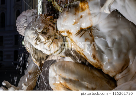 Vienna, Austria, August 17, 2022. Night portrait of a fountain statue next to the entrance of the Hofburg Imperial Palace. Artificial light and water features enhance realism. 115261750