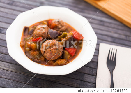 Cooked meatballs with stewed eggplant in bowl Cooked meatballs with stewed eggplant in bowl 115261751