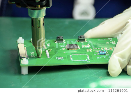 Close up scene the PCB board checking process by operator. 115261901
