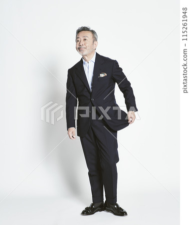 Middle-aged businessman on white background (full body) 115261948