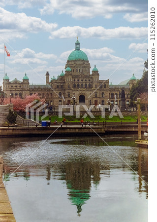 Victoria,BC, Canada. May 5, 2024. The Parliament Buildings reflecting in the water, located Belleville Street in Victoria, British Columbia. 115262010