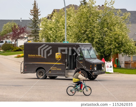 Calgary, Alberta, Canada. May 31, 2024. An UPS shipping delivery truck on the road. Calgary, Alberta, Canada. May 31, 2024. An UPS shipping delivery truck on the road. 115262035