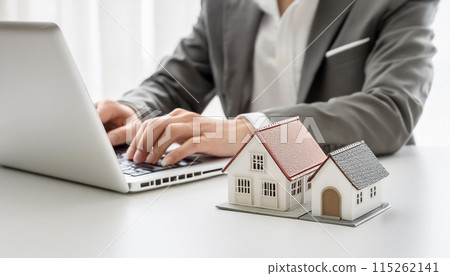 Searching for a house using a computer Real estate business image Searching for a house using a computer Real estate business image 115262141