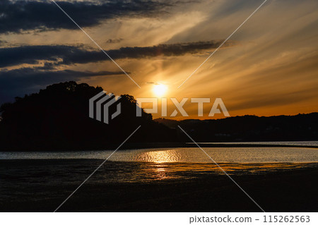 Beautiful sunset by the sea Beautiful sunset by the sea 115262563