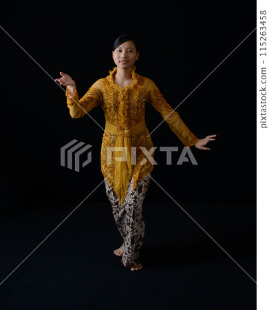 Indonesian Woman in Ornate Traditional Dance Attire Indonesian Woman in Ornate Traditional Dance Attire 115263458