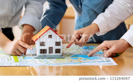Everyone points to the house, looking for a house, deciding, real estate issues 115264097