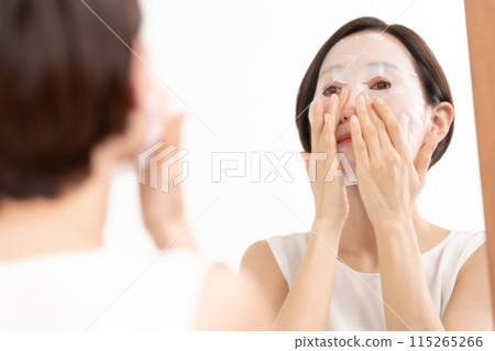 Woman applying face mask, beauty, skin care Woman applying face mask, beauty, skin care 115265266