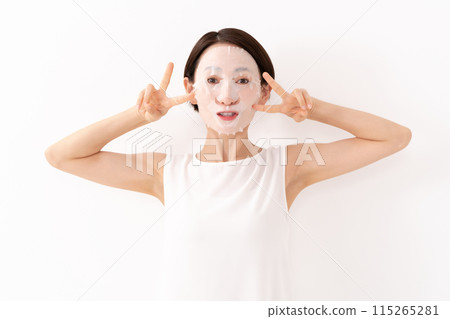 Woman applying face mask, beauty, skin care Woman applying face mask, beauty, skin care 115265281