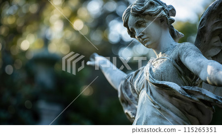 Angel statue with outstretched hand. 115265351