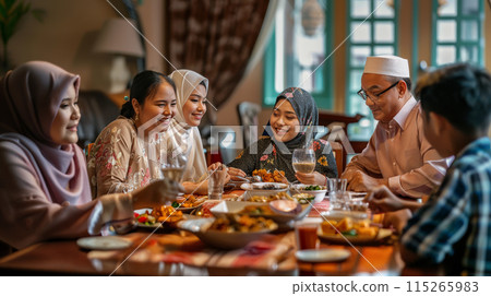 Muslim family gathering around dining table 115265983