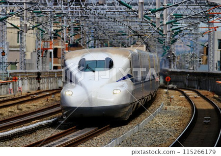 The Sanyo Shinkansen bullet train runs through Nishi-Akashi Station on the Sanyo Line at a rapid pace... The Sanyo Shinkansen bullet train runs through Nishi-Akashi Station on the Sanyo Line at a rapid pace... 115266179