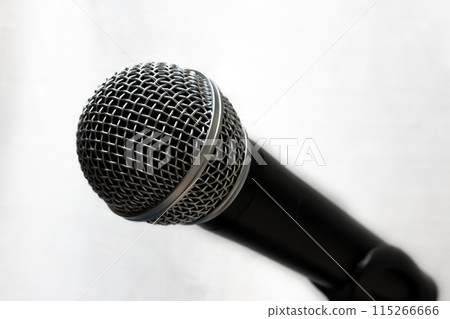 One dynamic microphone on a white solid background One dynamic microphone on a white solid background 115266666