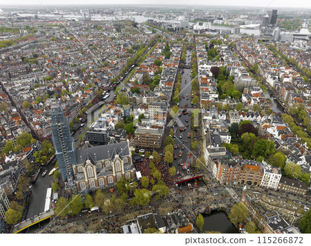 Kings Day 2024 in Amsterdam. Koningsdag, Koeningsdag in Capital of the Netherlands, Aerial Drone Fly Over Orange Suits. 115266872
