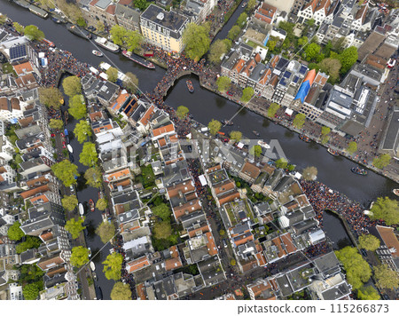 Kings Day 2024 in Amsterdam. Koningsdag, Koeningsdag in Capital of the Netherlands, Aerial Drone Fly Over Orange Suits. Kings Day 2024 in Amsterdam. Koningsdag, Koeningsdag in Capital of the Netherlands, Aerial Drone Fly Over Orange Suits. 115266873