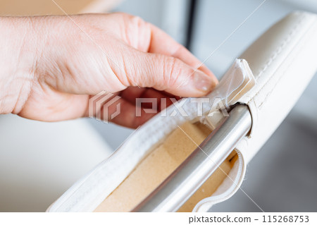 woman's hand demonstrates a torn zipper, damaged, woman's hand demonstrates a torn zipper, damaged, 115268753
