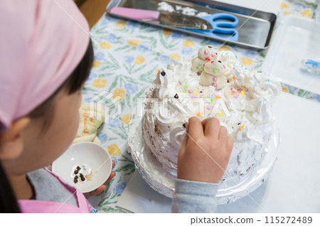 Elementary school children make cakes in a cooking class 115272489