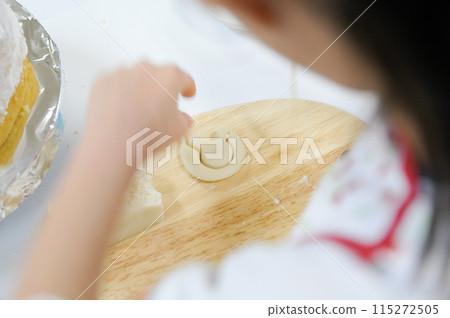 Elementary school children make cakes in a cooking class Elementary school children make cakes in a cooking class 115272505