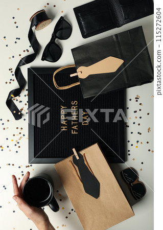 Inscription on a black board for Father's Day, on a light background. 115272604