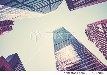 Looking up at New York City skyscrapers, color toning applied, USA. 115272802