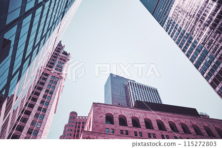 Looking up at New York City skyscrapers, color toning applied, USA. Looking up at New York City skyscrapers, color toning applied, USA. 115272803