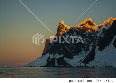 Lemaire strait coastal landscape, mountains and icebergs, Antarctic Peninsula, Antartica. 115273109