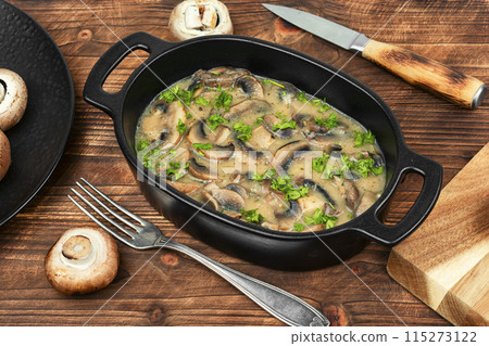 Tasty mushroom sauce on wooden background 115273122