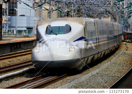 The Sanyo Shinkansen [N700 Series S] swiftly runs through Nishi-Akashi Station on the Sanyo Line 115273170