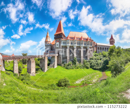 Captivating panoramic morning view of Hunyad Castle / Corvin's Castle with wooden bridge. 115273222