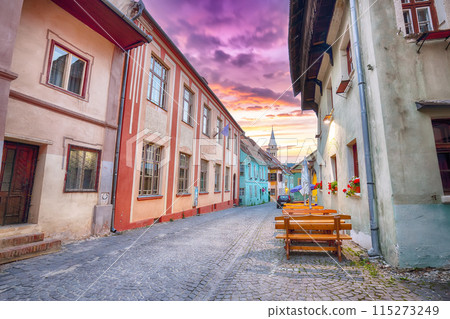 Amazing evening view of historic town Sighisoara and Clock Tower built by Saxons. 115273249