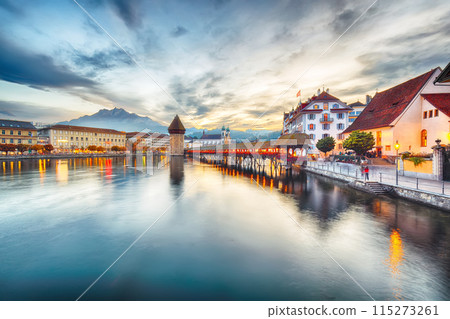Marvelous historic city center of Lucerne with famous buildings and old wooden Chapel Bridge (Kapellbrucke) 115273261