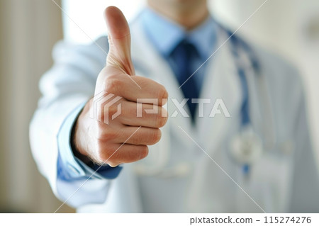Doctor giving thumbs up gesture in hospital setting Doctor giving thumbs up gesture in hospital setting 115274276